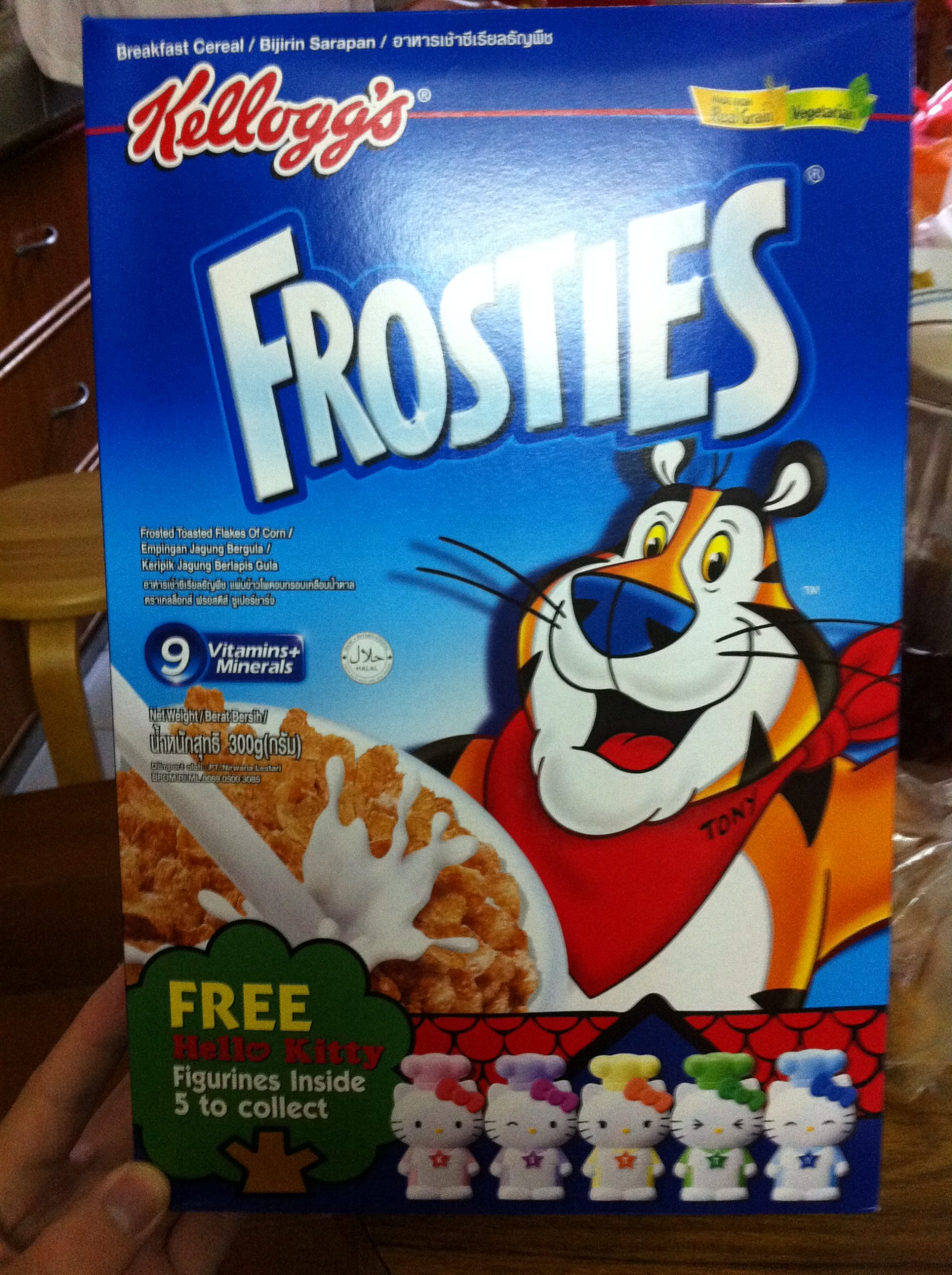 A box of Kellog's Frosties cereal with free Hello Kitty figurine