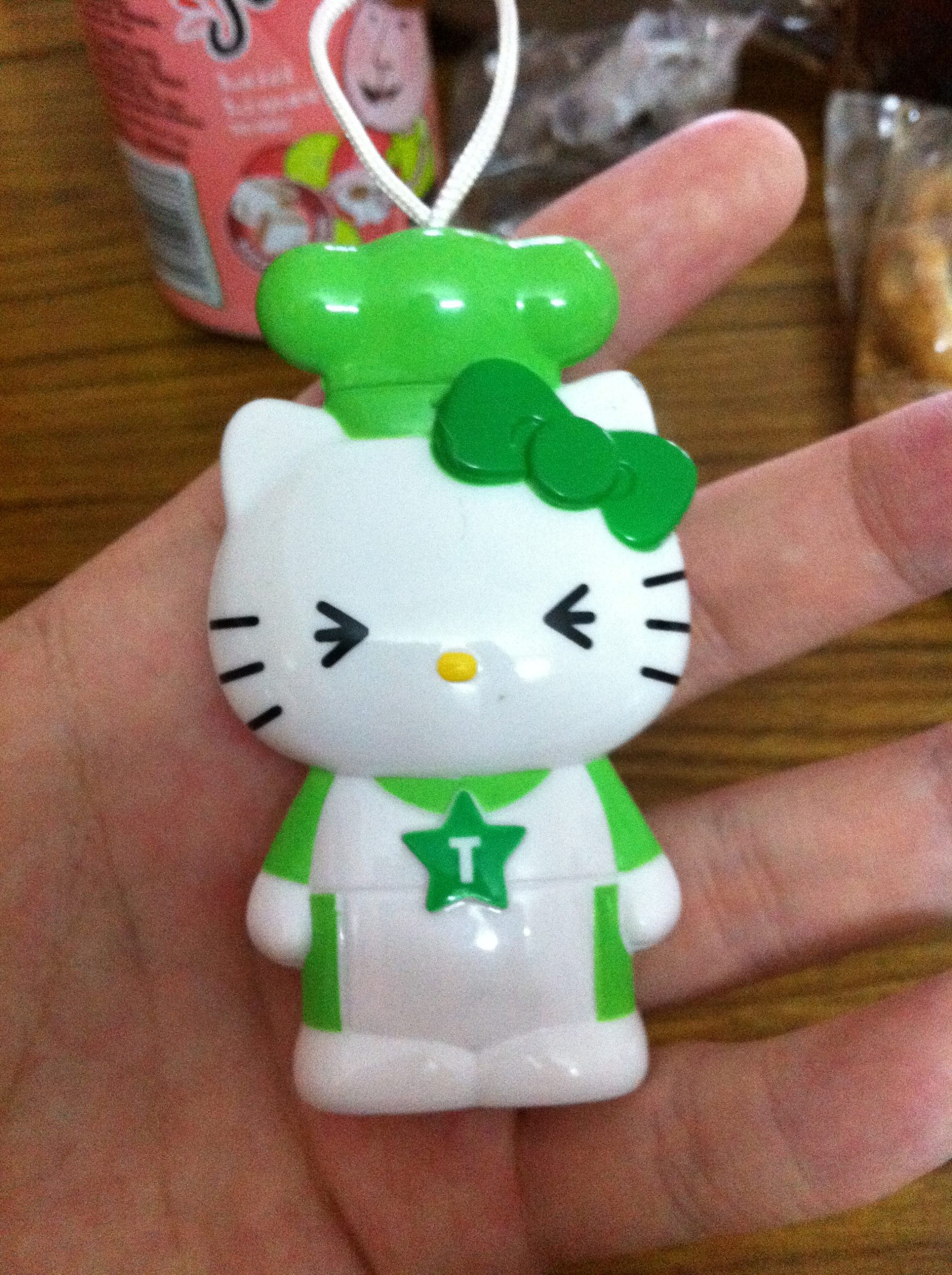 The green Hello Kitty figurine from the aforementioned Frosties cereal box