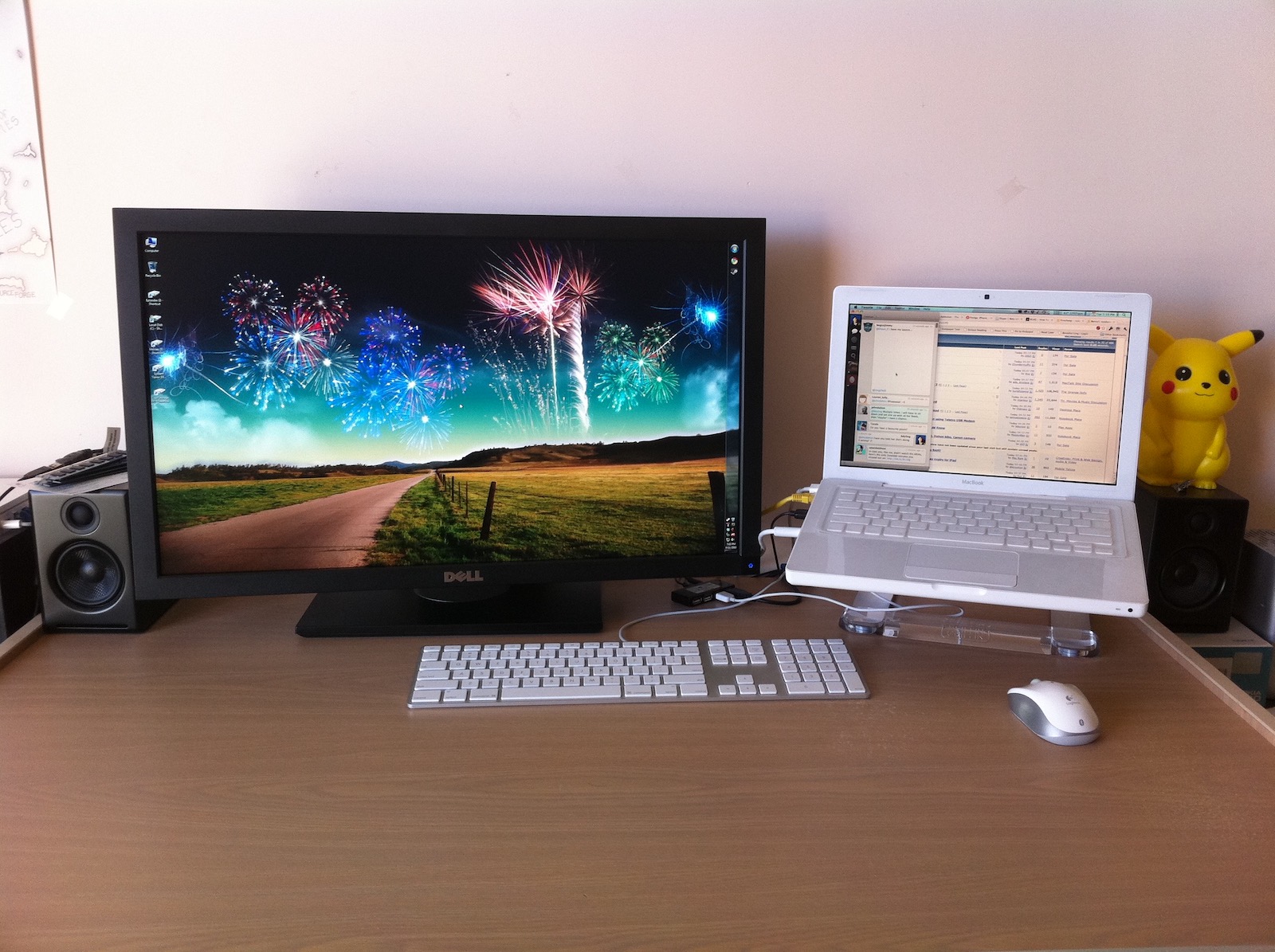 Dell U2711 beside a white 13-inch MacBook